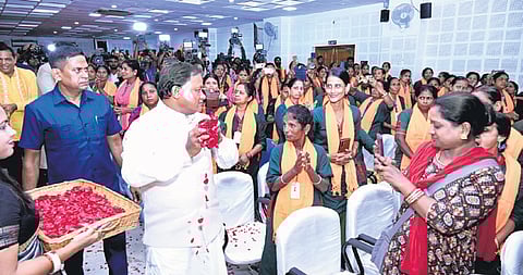 CM Mohan Charan Majhi showering flower petals on sanitation workers