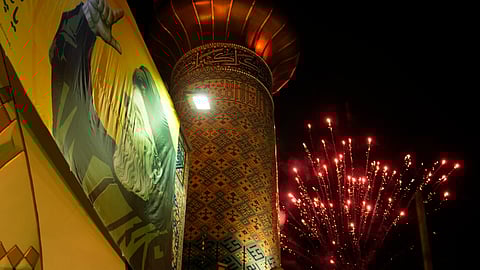 Fireworks explode next a portrait of slain Hezbollah leader Hassan Nasrallah and a minaret of a mosque in an anti-Israeli gathering celebrating Iran's missile strike against Israel, at Felestin (Palestine) Sq. in Tehran, Iran.