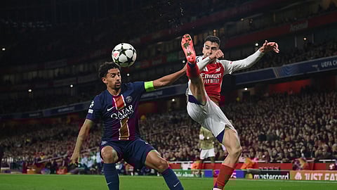 PSG defender Marquinhos vies with Arsenal's midfielder Gabriel Martinelli during the UEFA Champions League football match between Arsenal and PSG.