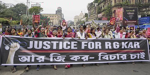 Members of the Bengal Junior Doctors' Front and others take part in a mega rally on 'Mahalaya' to demand justice for the alleged sexual assault and murder of a trainee doctor at RG Kar Medical College and Hospital, in Kolkata