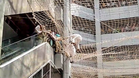 Maharashtra assembly Deputy Speaker Narhari Zirwal and others being rescued from the safety nets after they jumped off the third floor of the Mantralaya building, in Mumbai, Friday, Oct. 4, 2024.