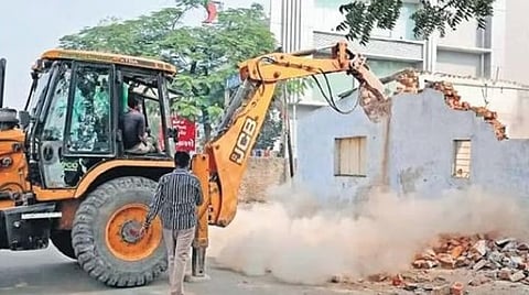 The complainant, D Muthumari, told TNIE that nearly eight assailants reached her home around 3 am on Tuesday, and demolished her mud-roof house using an earth mover.