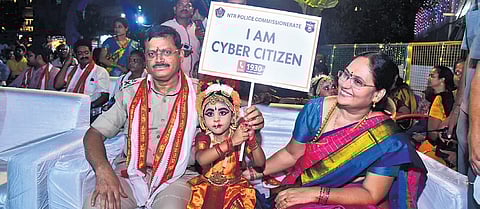 NTR district CP SV Rajashekhar Babu promoting cyber citizen mobile applications during Dasara festivities