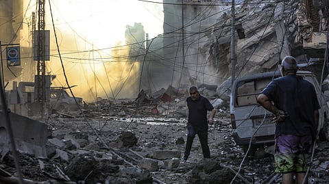 Residents check the destruction in the aftermath of an Israeli strike on the neighbourhood of Mreijeh in Beirut's southern suburbs on October 4, 2024.