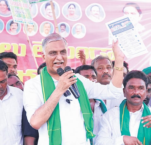 Former minister T Harish Rao addresses a public meeting organised to lend support to farmers, in Thorrur mandal of Mahabubabad district on Friday