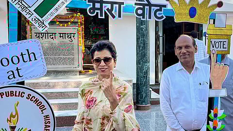 Congress leader Kumari Selja shows her finger marked with indelible ink after casting vote at a polling station during the Haryana Assembly elections, in Hisar.