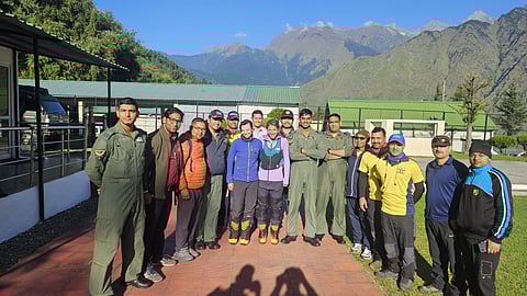 The Indian Air Force and the State Disaster Response Force (SDRF) team with mountaineers, Michelle Theresa and Favgane Manners.