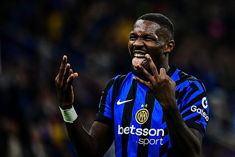 Inter Milan's French forward Marcus Thuram celebrates after scoring his team's third goal during the Italian Serie A football match between Inter Milan and Torino at San Siro Stadium in Milan on October 5, 2024.