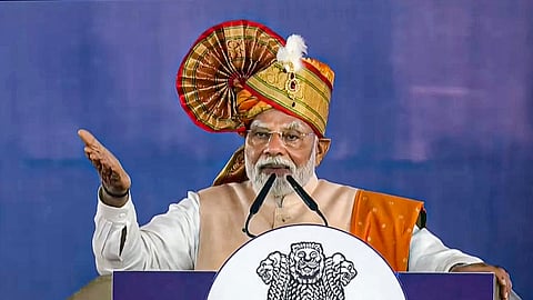 Prime Minister Narendra Modi addresses a gathering during the foundation stone laying and inauguration of various development projects, in Thane.