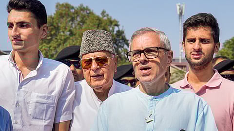 Jammu and Kashmir National Conference (JKNC) President Farooq Abdullah and Vice President Omar Abdullah interact with the media after casting votes during the second phase of Jammu and Kashmir Assembly elections, in Srinagar.