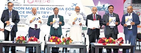 Dignitaries releasing a booklet on opportunities in defence manufacturing in Odisha