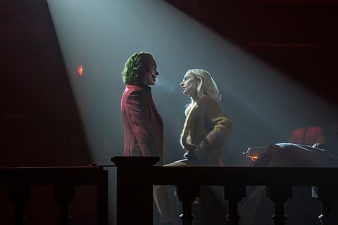This image released by Warner Bros. Pictures shows Joaquin Phoenix, left, and Lady Gaga in a scene from "Joker: Folie à Deux."