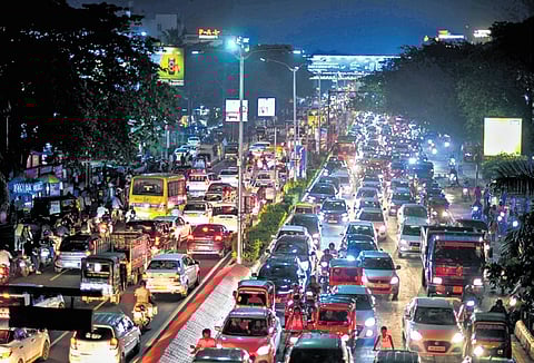 Vehicles caught in traffic jam at Jayadev Vihar in Bhubaneswar on Monday evening