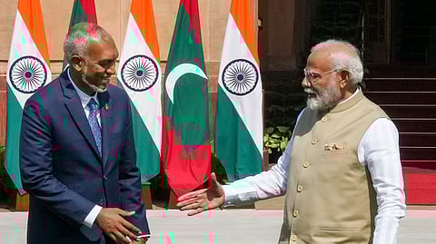 Prime Minister Narendra Modi shakes hands with Maldives President Mohamed Muizzu in New Delhi/