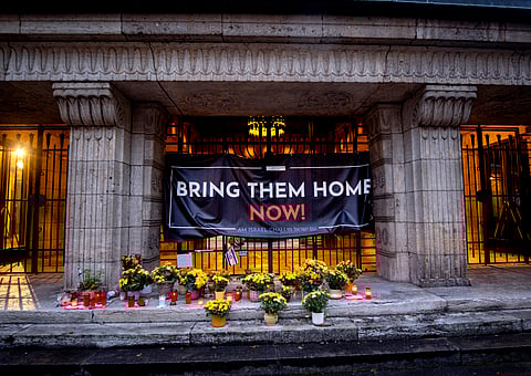 Candles and flowers are laid at the entrance of the synagogue to mark the first anniversary of the Hamas attack on Israel, Frankfurt, Germany.