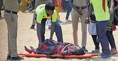 A woman being carried on a stretcher from the Marina on Sunday