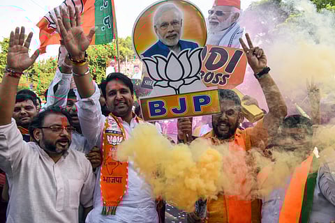 Bharatiya Janata Party (BJP) supporters celebrating at BJP headquarters in New Delhi on Tuesday.
