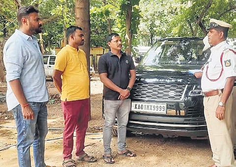 MLA Janardhana Reddy’s car on the premises of Gangavathi police station in Koppal district on Tuesday