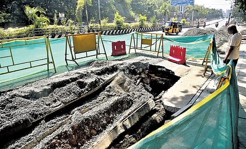The road near Mylapore caved in following rains on Monday night | P Ravikumar