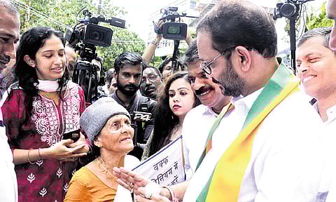 BJP state president K Surendran meets 89-year-old Mahathi, a resident of Munambam, who has been affected by the Waqf claim on the land she owns.