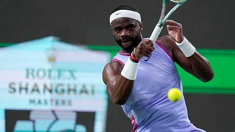Frances Tiafoe of the United States returns a shot to Zhou Yi of China during the men's singles second round match in the Shanghai Masters tennis tournament on Monday, Oct. 7, 2024.