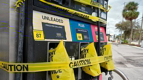 Gas pumps are covered at a station ahead of arrival of Hurricane Milton.