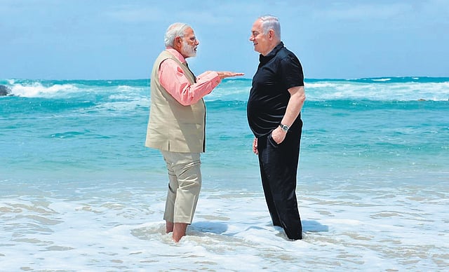 A file photo of Modi and Netanyahu strolling along the Mediterranean shore of Dor in Haifa.