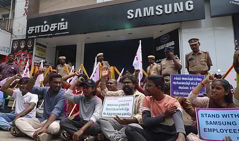 Members of DYFI stage a protest in front of samsung showroom in Madurai for support of Samsung workers.