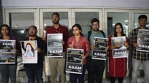 Resident Doctors Association (RDA), AIIMS hold candle march over RG Kar Medical College and Hospital rape-murder case in New Delhi on Wednesday.
