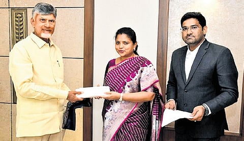 WG Collector C Nagarani handing over the cheque to CM Naidu