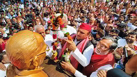 Samajwadi Party chief Akhilesh Yadav garlands the statue of Jayaprakash Narayan to mark his birth anniversary, at Jayaprakash Narayan International Centre (JPNIC), in Lucknow, Friday, Oct. 11, 2024.