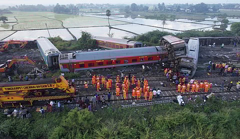 Indian railway workers and TNDRF restoring the train accident site.