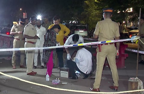 Forensic team investigates at the site where former Maharashtra minister Baba Siddique was shot dead by three assailants, in Mumbai, Saturday night, Oct. 12, 2024.