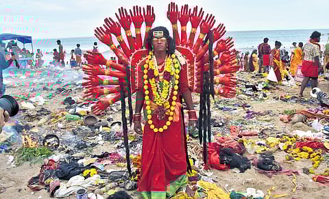 A woman devotee dressed up as a goddess at the Kulasekarapattinam Mutharamman temple festival in Thoothukudi on Saturday.