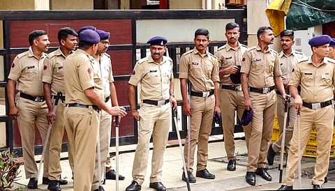 Security personnel stand guard outside deceased NCP leader Baba Siddique's residence, in Mumbai, Sunday, Oct. 13, 2024. Siddique was shot dead by three assailants on Saturday.