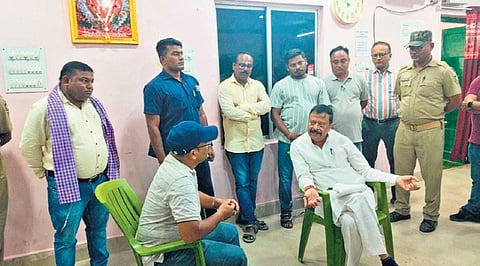Pujari speaking to an official at the sub registrar office in Sambalpur