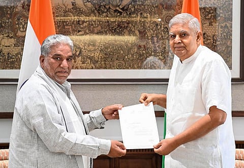 Vice-President Jagdeep Dhankhar receives the letter of resignation of Rajya Sabha member Krishan Lal Panwar, in New Delhi.