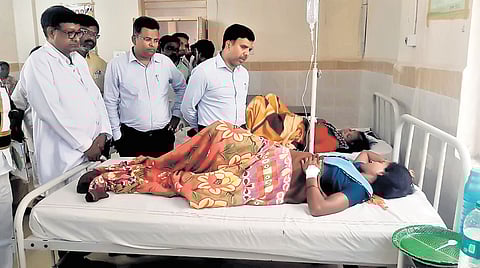 Additional Collector (Local Bodies) Chandrasekhar on Monday interacts with a woman patient from Sanjeevraopet village who fell ill after drinking contaminated water in Sangareddy district on Saturday