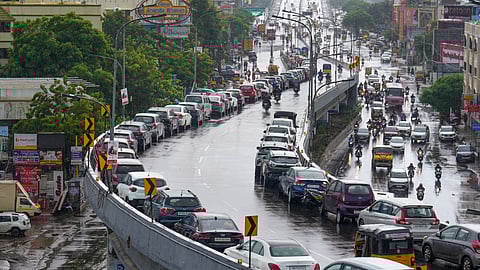 Residents park their cars on the Velachery flyover as the India Meteorological Department (IMD) has issued a red alert predicting heavy rains in Chennai.