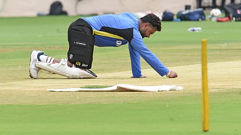 Rishabh Pant checking the pitch
