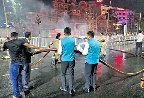 Staff of hotel Crown helping firemen in dousing the blaze.
