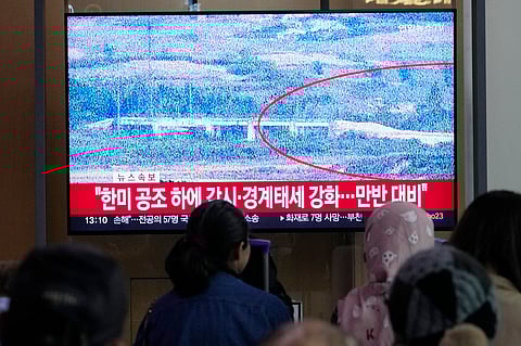 A TV screen reports North Korea has blown up parts of northern side of inter-Korean roads during a news program at Seoul Railway Station in Seoul, South Korea on Tuesday.