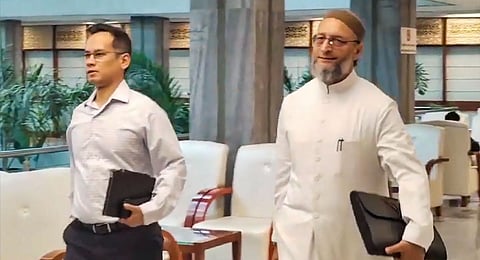 AIMIM MP Asaduddin Owaisi with Congress MP Gaurav Gogoi arrives for a Joint Parliamentary Committee meeting on the Waqf (Amendment) Bill 2024, in New Delhi, Monday, Oct. 14, 2024.