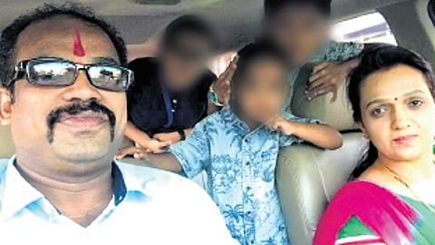 File photo of deceased Santosh with his wife and children