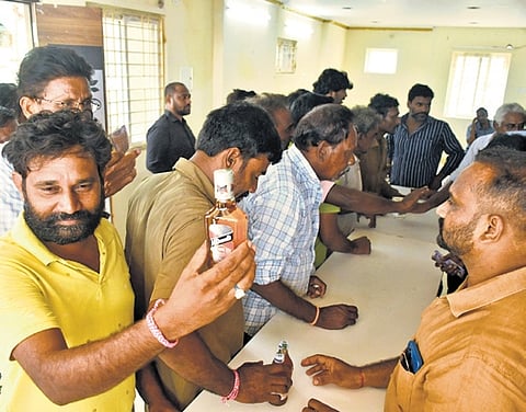 Crowd at a new wine shop in Vijayawada on Wednesday