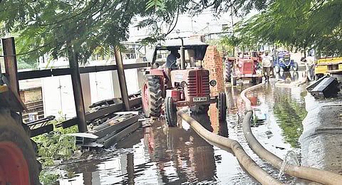 Floodwater being pumped out from the Korukupet railway station premises in Chennai