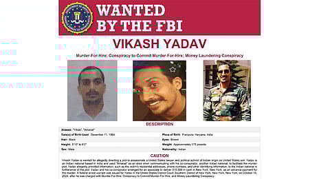 This wanted poster provided by the FBI shows Vikash Yadav, an Indian government employee, wanted on criminal charges in connection with a foiled plot to kill a U.S. citizen in New York City.