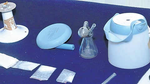 Ganja, gun and 6 bullets seized, Two held