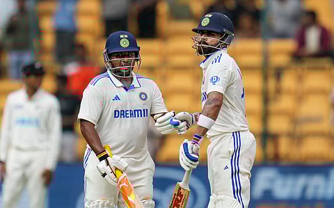 Virat Kohli (right) and Sarfaraz Khan were involved in a 136-run partnership (Photo | PTI)