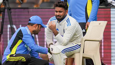Indias wicket-keeper Rishabh Pant reacts after being taken off field following an injury on the second day of the first test cricket match between India and New Zealand, at the M Chinnaswamy Stadium, in Bengaluru, Thursday, Oct. 17, 2024.